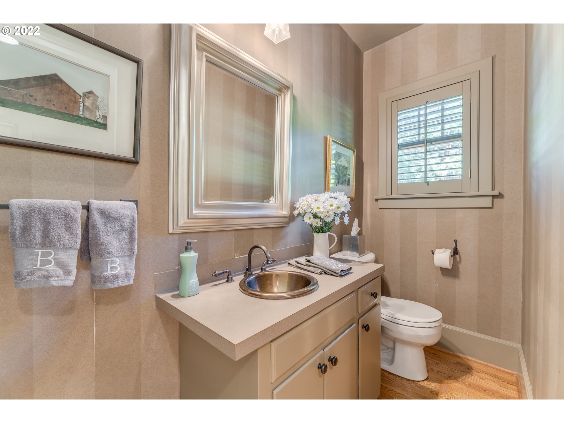 3900 Southwest Dosch Road Portland, OR 97239 - Photo 12 of 32 a bathroom with a sink toilet and a mirror