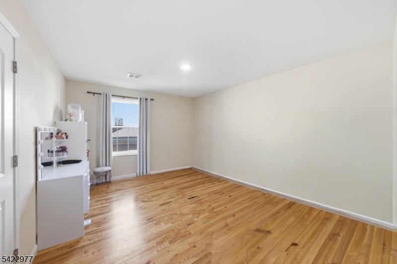 175 North 7th Street Newark, NJ 07107 - Photo 13 of 17 a view of empty room with wooden floor