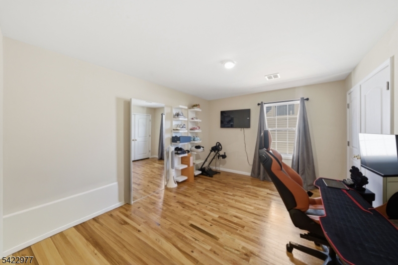 175 North 7th Street Newark, NJ 07107 - Photo 15 of 17 a bed room with a bed and a tv