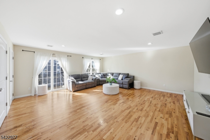 175 North 7th Street Newark, NJ 07107 - Photo 3 of 17 a view of a livingroom with furniture and wooden floor