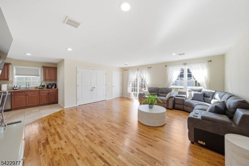 175 North 7th Street Newark, NJ 07107 - Photo 4 of 17 a living room with furniture and a view of kitchen