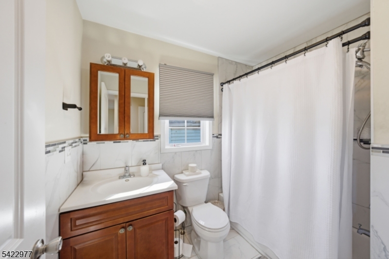 175 North 7th Street Newark, NJ 07107 - Photo 8 of 17 a bathroom with a sink toilet and shower