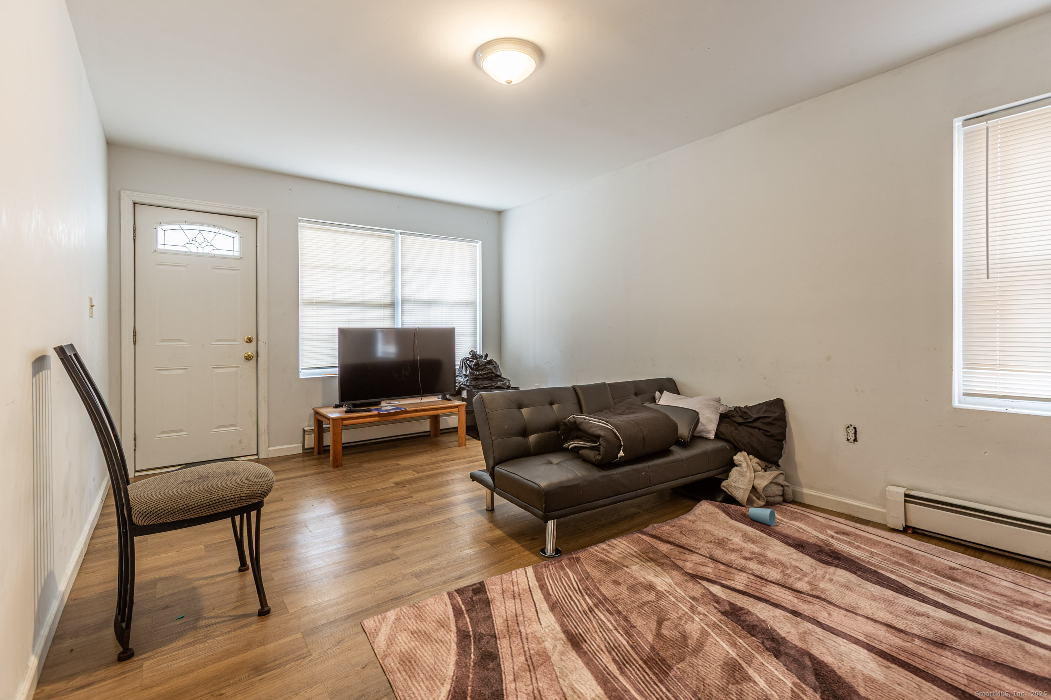 147 Enfield Street Hartford, CT 06112 - Photo 17 of 34 a living room with furniture and a flat screen tv