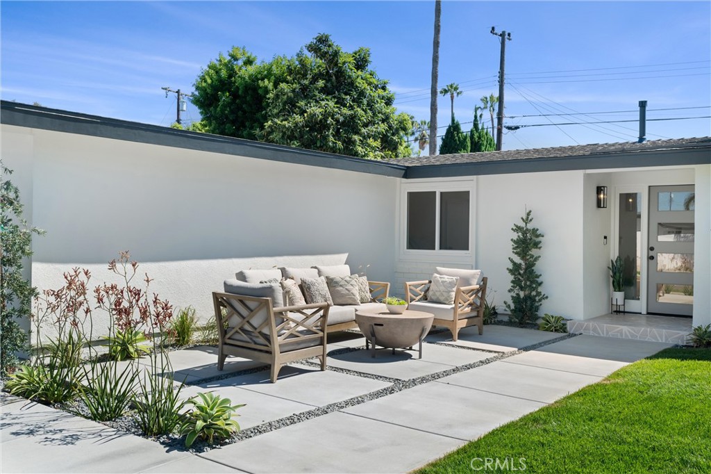 1709 Orcas Drive Costa Mesa, CA 92626 - Photo 1 of 25 a view of a patio with couches and potted plants