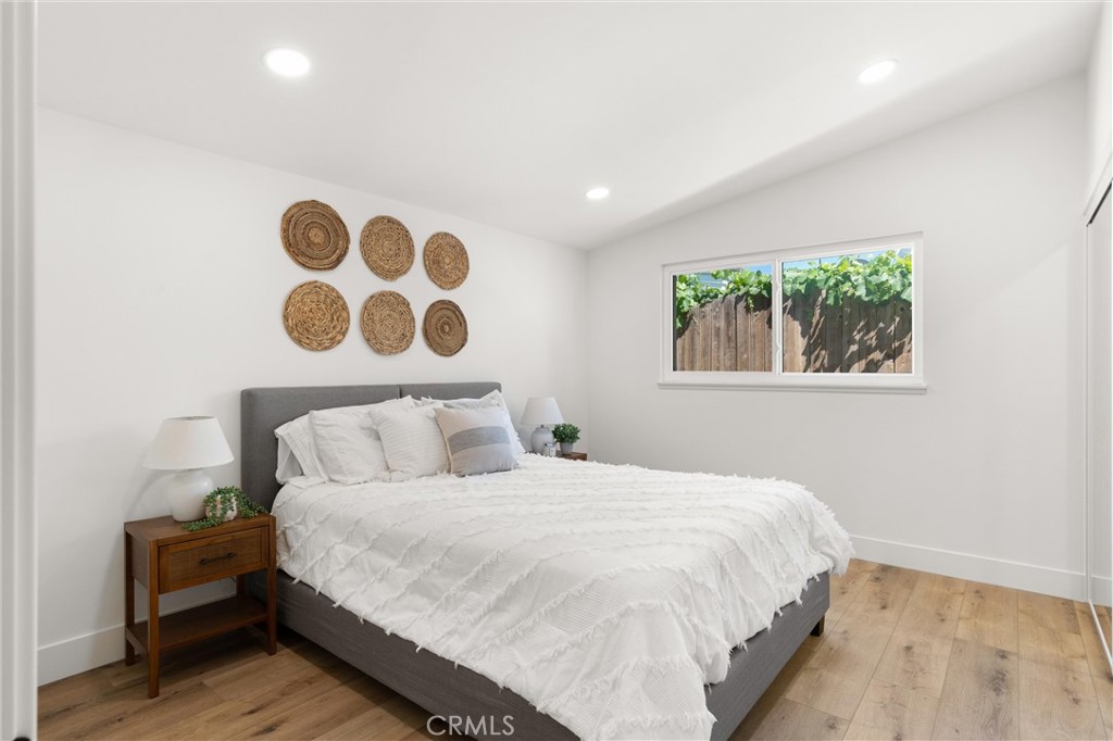 1709 Orcas Drive Costa Mesa, CA 92626 - Photo 18 of 25 a bedroom with a bed and a painting on the wall