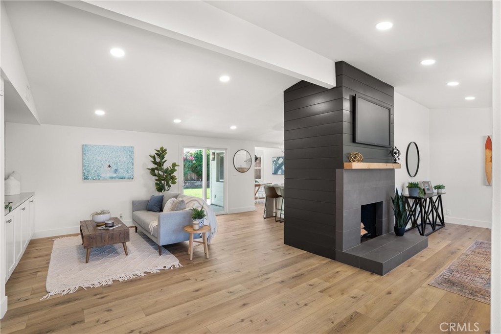 1709 Orcas Drive Costa Mesa, CA 92626 - Photo 4 of 25 a living room with furniture and a fireplace