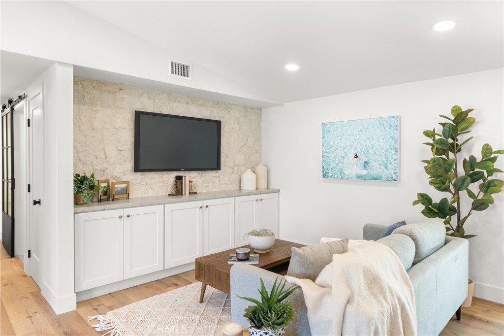 1709 Orcas Drive Costa Mesa, CA 92626 - Photo 6 of 25 a living room with furniture and a flat screen tv