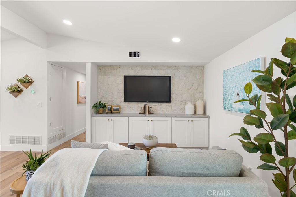 1709 Orcas Drive Costa Mesa, CA 92626 - Photo 7 of 25 a living room with furniture and a flat screen tv