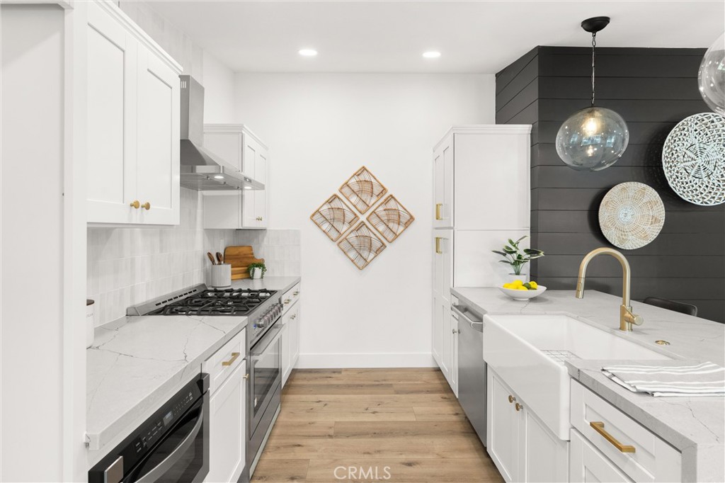 1709 Orcas Drive Costa Mesa, CA 92626 - Photo 8 of 25 a kitchen that has a lot of cabinets
