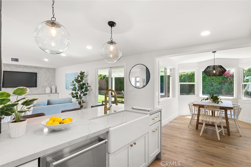 1709 Orcas Drive Costa Mesa, CA 92626 - Photo 10 of 25 a kitchen with a table and chairs in it