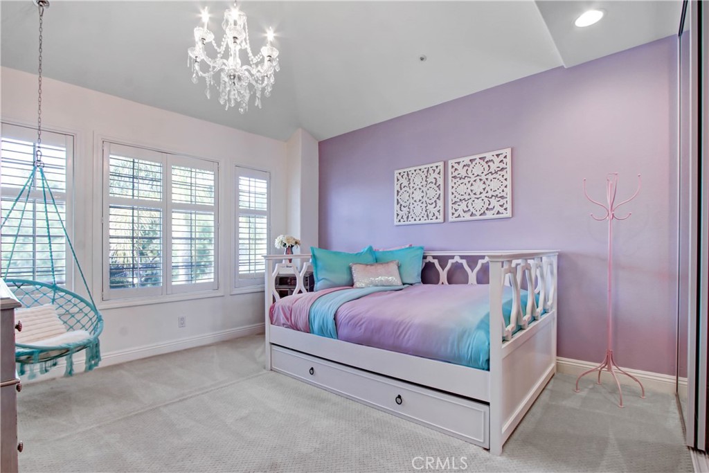 12036 Wood Ranch Road Granada Hills, CA 91344 - Photo 36 of 55 Upstairs 4th Bedroom with Egg Chair (purple wall has since been painted white)
