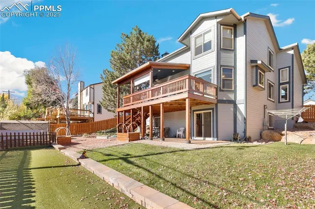 a view of a house with a iron gate