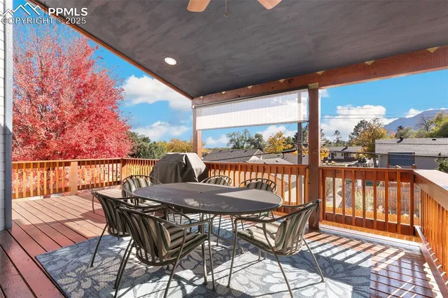 a view of a chairs and table in the balcony