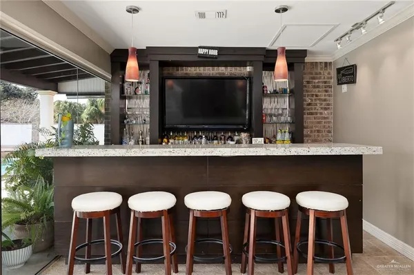 a kitchen with a table and chairs