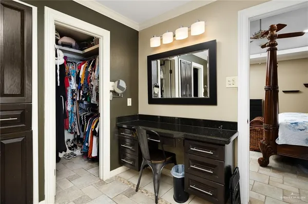 a spacious bathroom with a tub sink and mirror