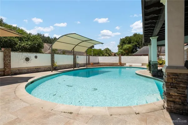 a view of outdoor space and swimming pool