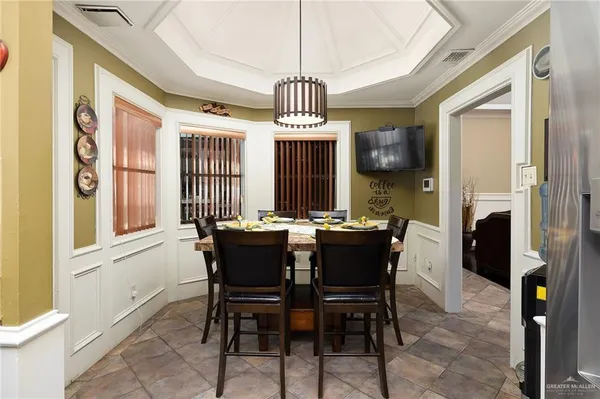 a view of a dining room with furniture window and outside view