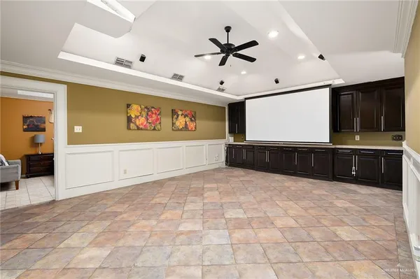 a view of an empty room with a kitchen