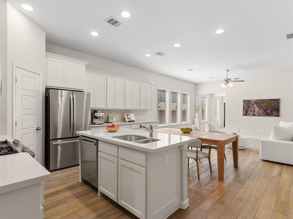 166 Palo Duro Bend Rhome, TX 76078 - Photo 14 of 40 Kitchen with generous workspace, storage, and seamless flow to the main living areas.
