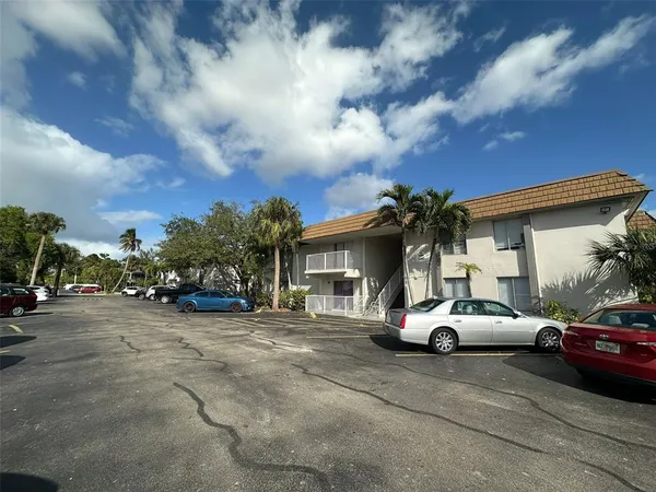 a view of a street with a building in the background