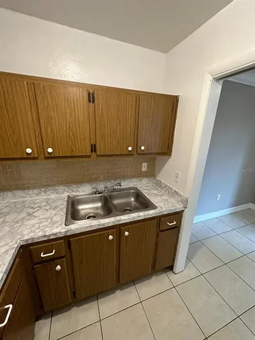 a kitchen with a sink and a stove