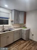 a view of kitchen sink and cabinet