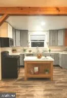 a kitchen with stainless steel appliances granite countertop a sink and cabinets
