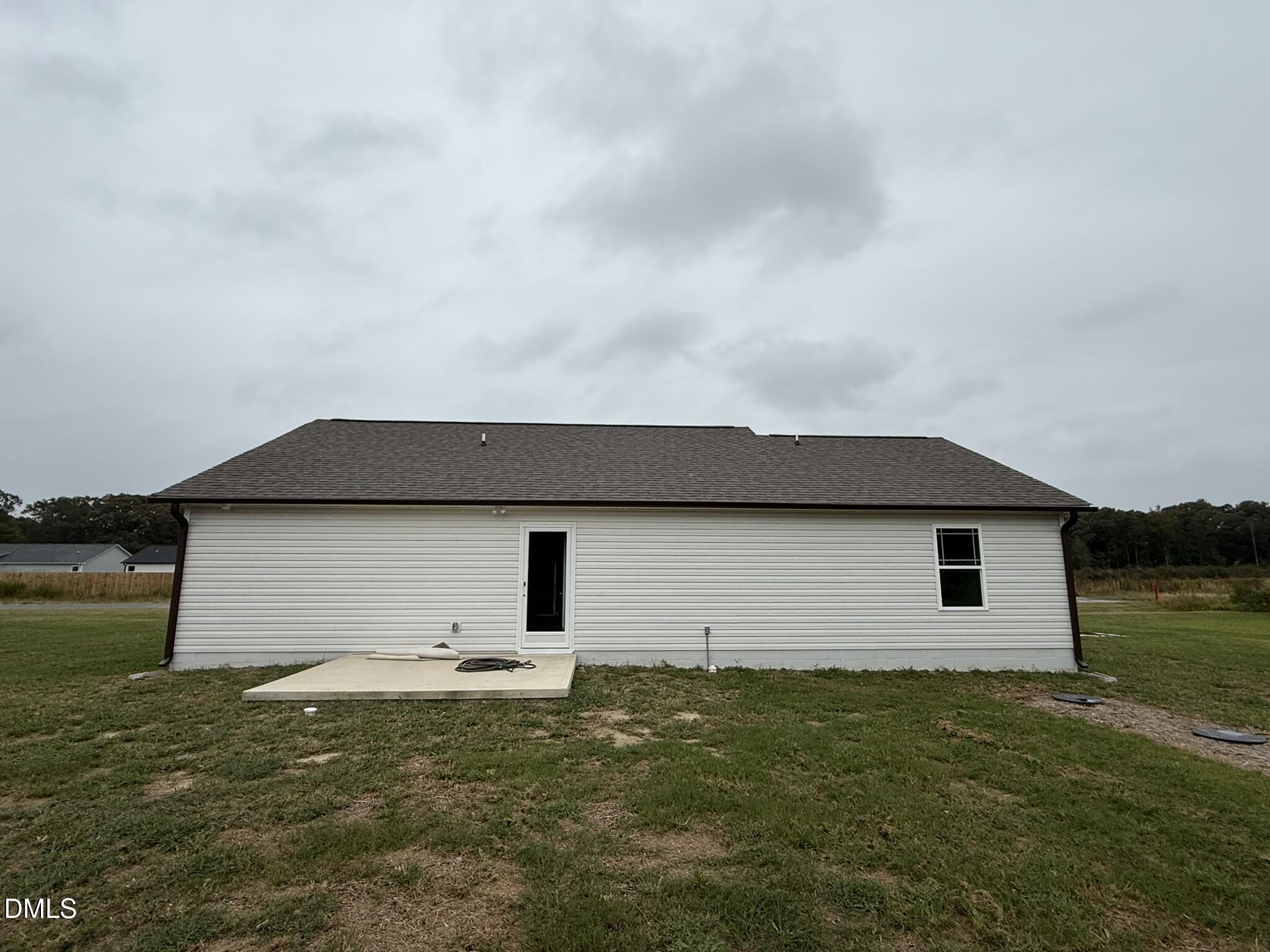 1843 Old Kenly Road Kenly, NC 27542 - Photo 15 of 16 a backyard of a house with table and chairs