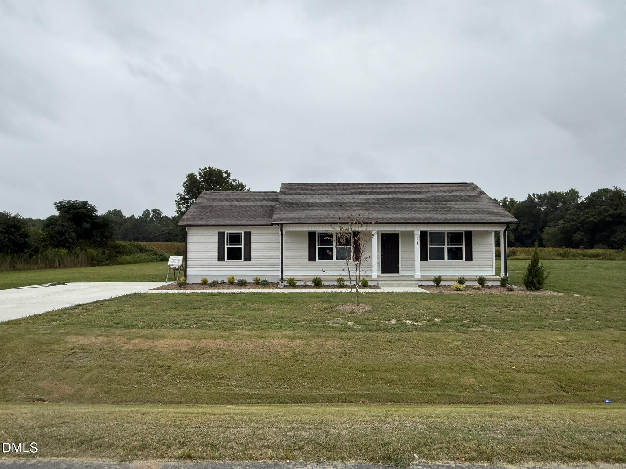 1843 Old Kenly Road Kenly, NC 27542 - Photo 2 of 16 a front view of a house with a garden