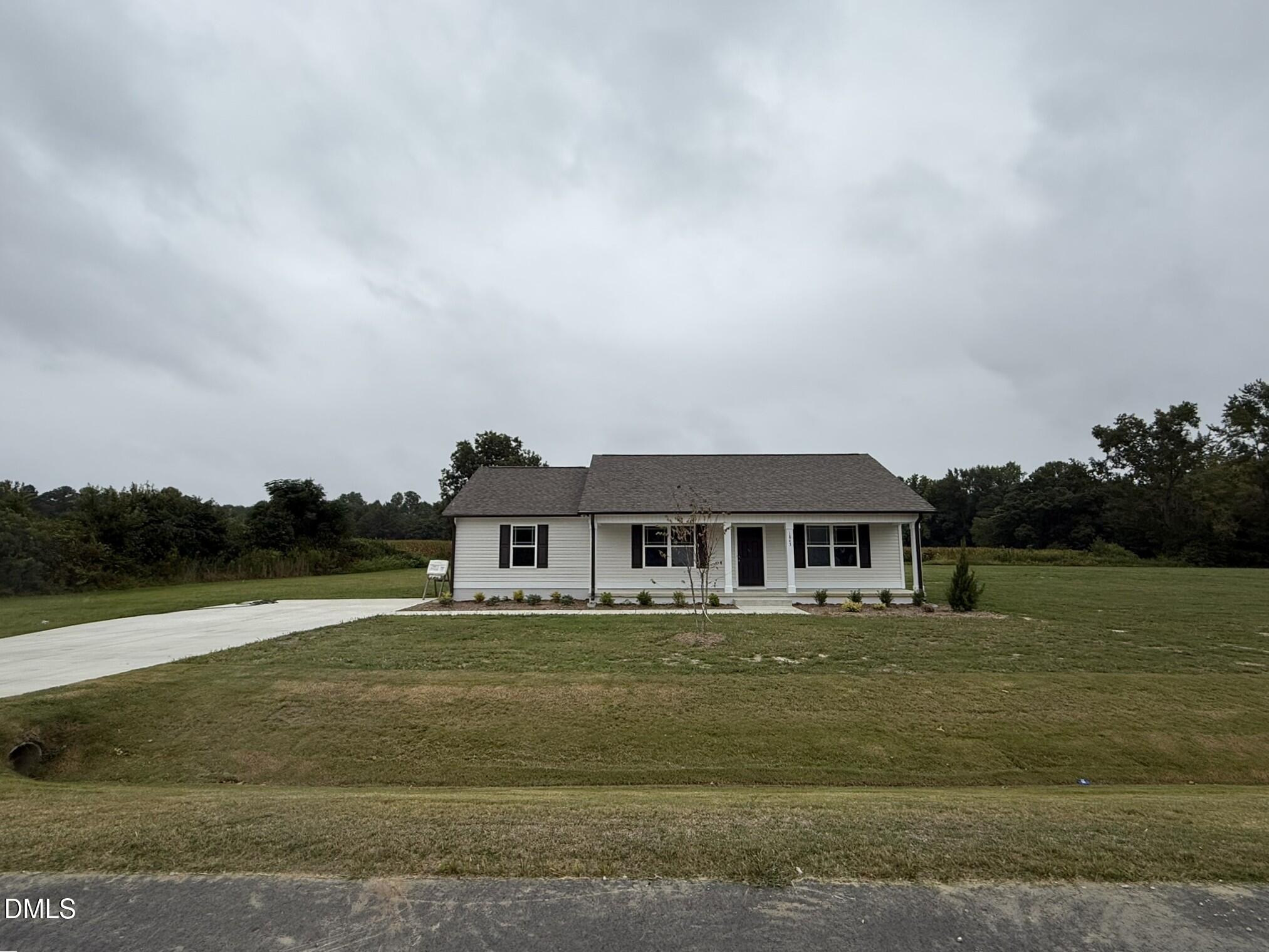 1843 Old Kenly Road Kenly, NC 27542 - Photo 3 of 16 a front view of a house with a yard