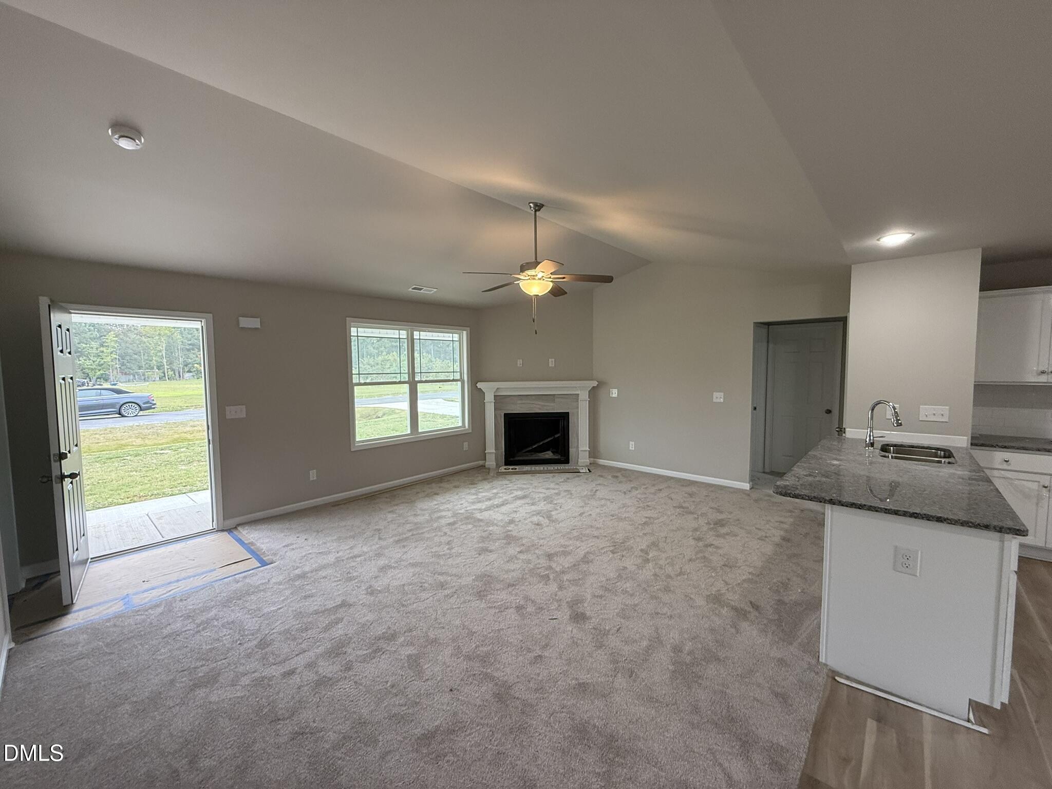 1843 Old Kenly Road Kenly, NC 27542 - Photo 5 of 16 a view of a kitchen with a sink and a fireplace