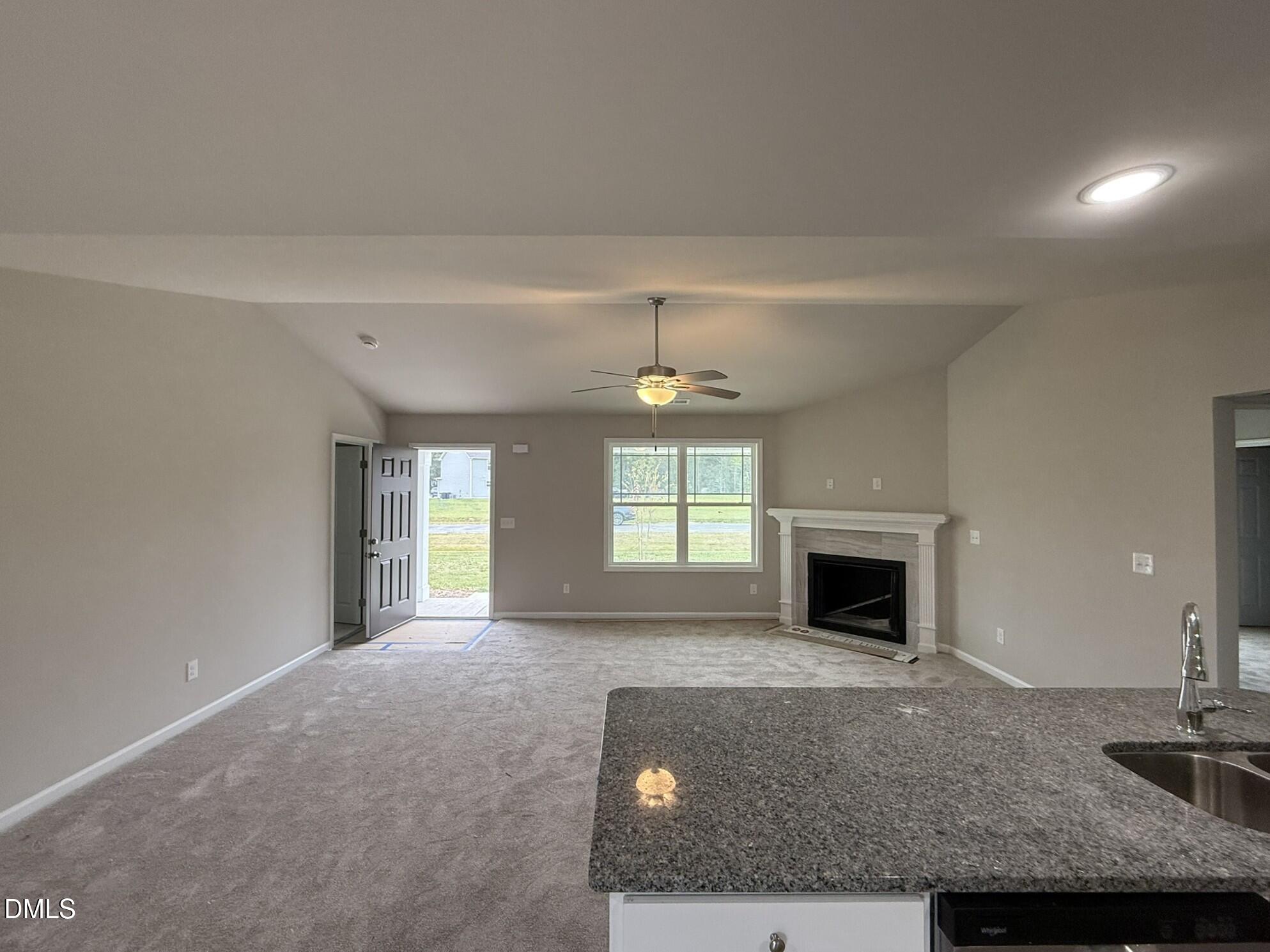 1843 Old Kenly Road Kenly, NC 27542 - Photo 6 of 16 a living room with furniture and a fireplace