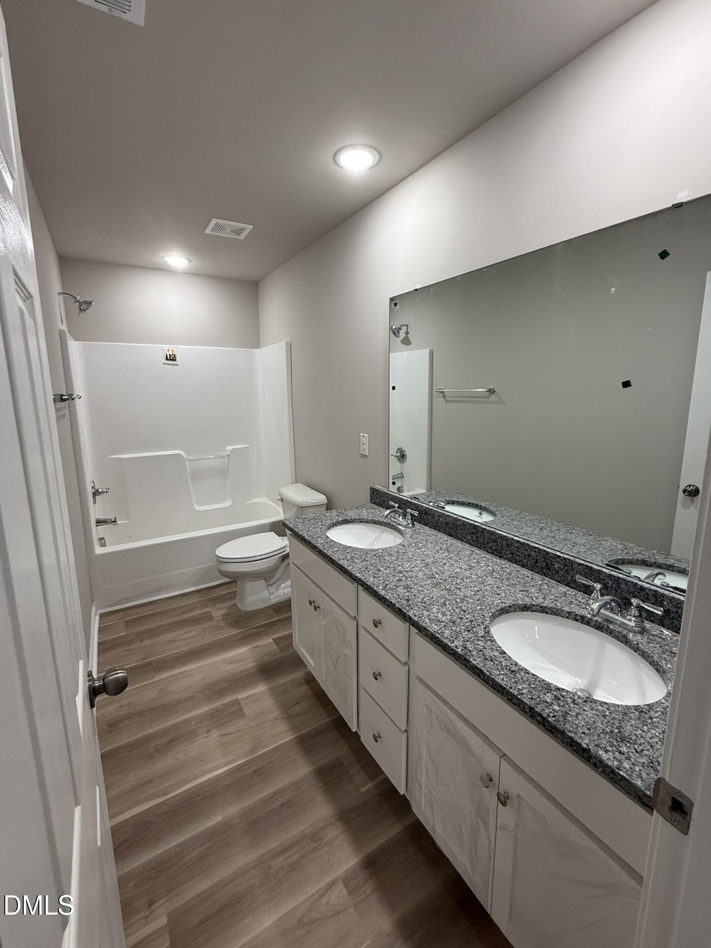 1843 Old Kenly Road Kenly, NC 27542 - Photo 10 of 16 a bathroom with double vanity sink and a mirror