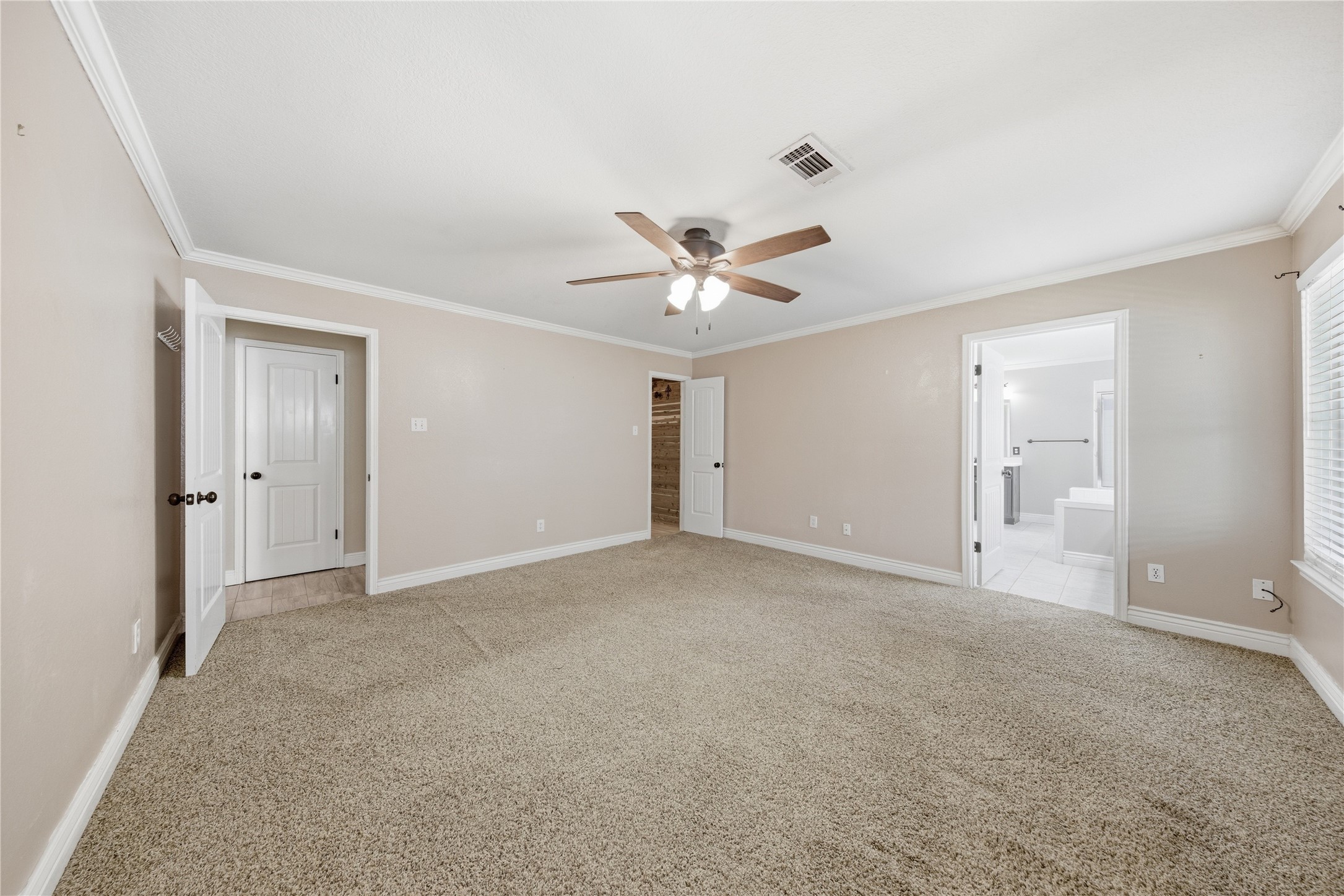 13506 Spring Court Tomball, TX 77375 - Photo 15 of 37 a view of an empty room with a ceiling fan
