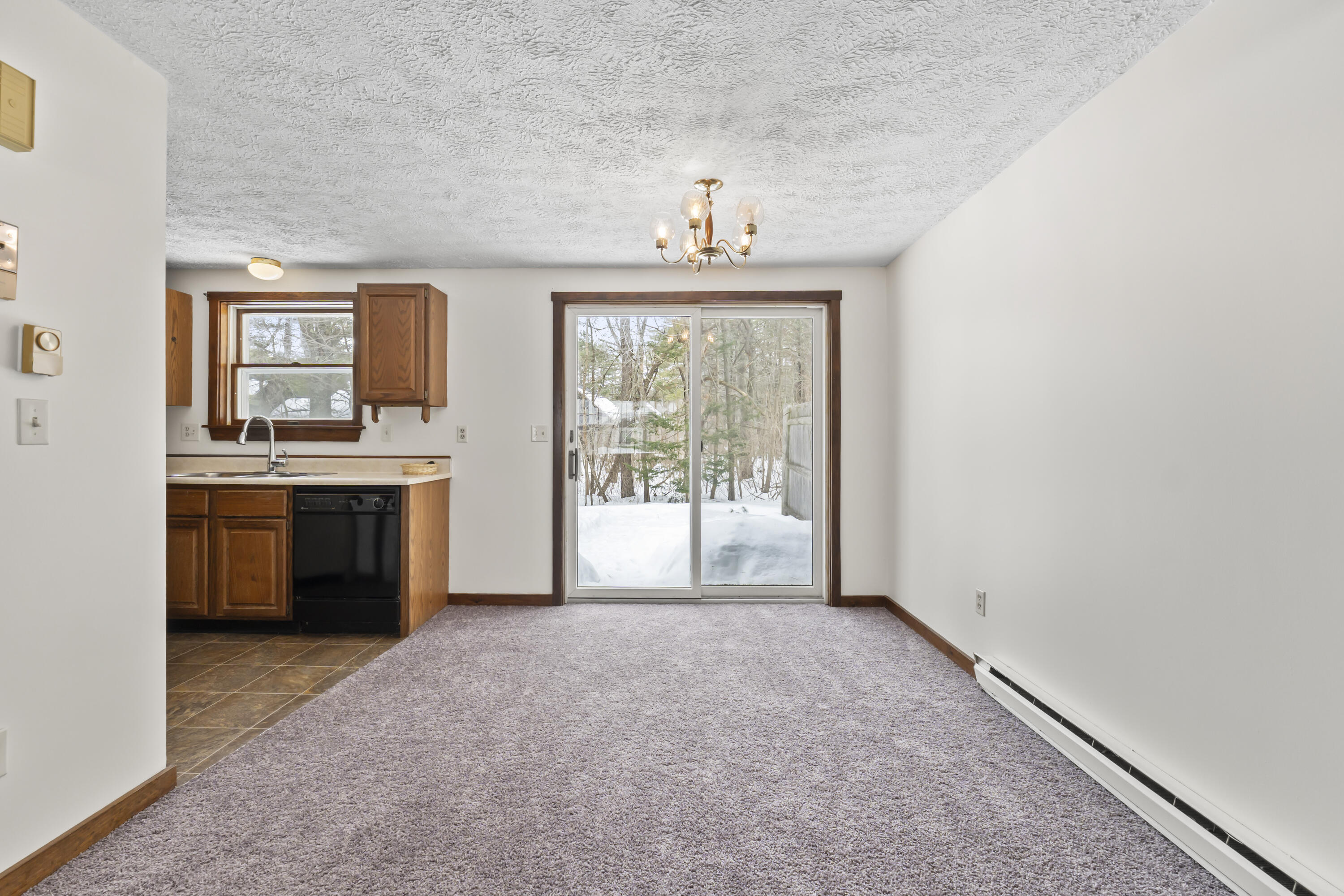 61 Ward Circle, Unit 61 Brunswick, ME 04011 - Photo 12 of 55 Dining area leading to outdoor patio