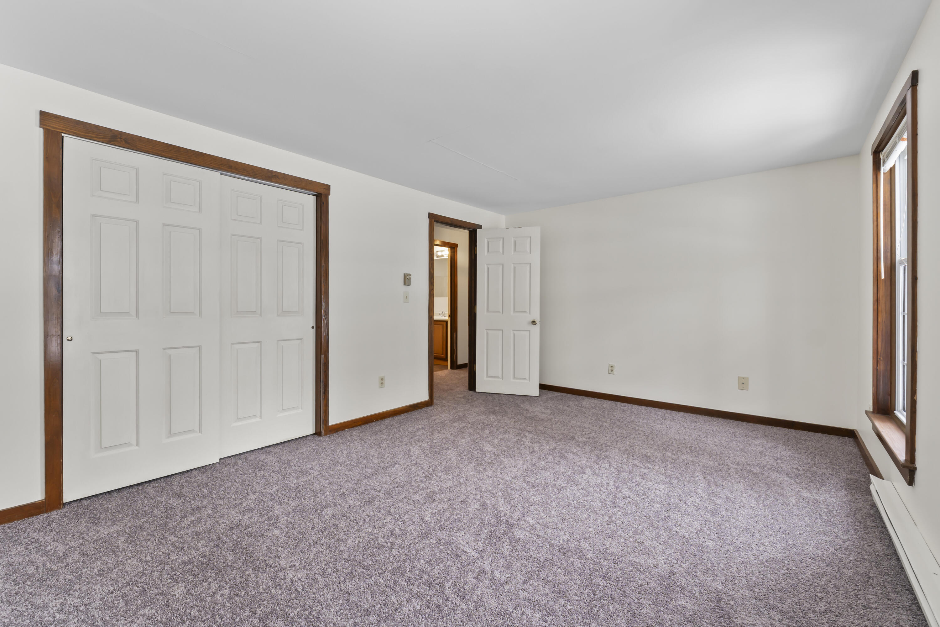 61 Ward Circle, Unit 61 Brunswick, ME 04011 - Photo 27 of 55 Downstairs primary bedroom and closet