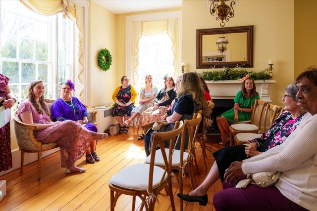a room with a large window and bed