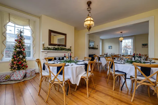 a living room with furniture and book shelf