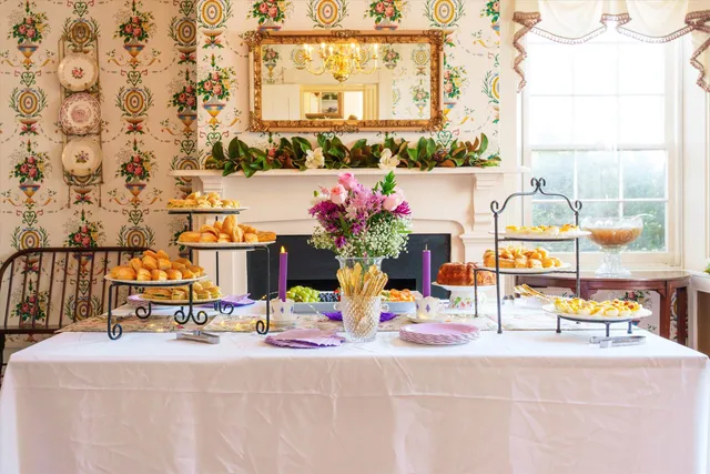 a living room with furniture a rug and a fireplace