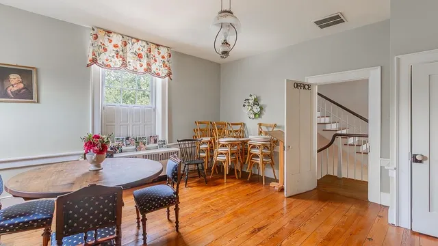 a bedroom with furniture and a window