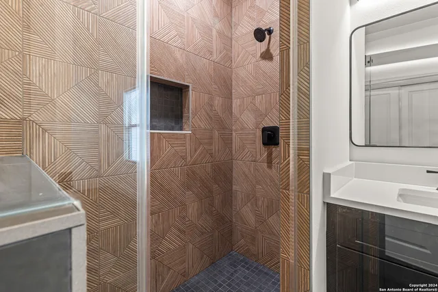 a bathroom with a sink and shower