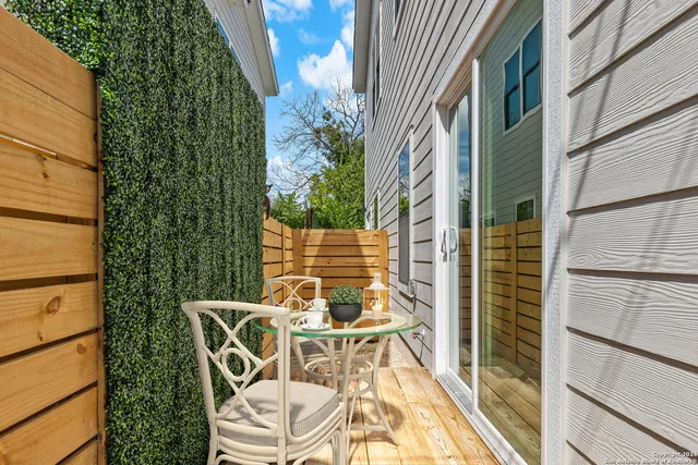 a view of a balcony with chairs