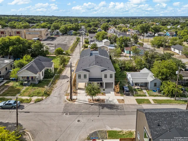 an aerial view of a house with a swimming pool