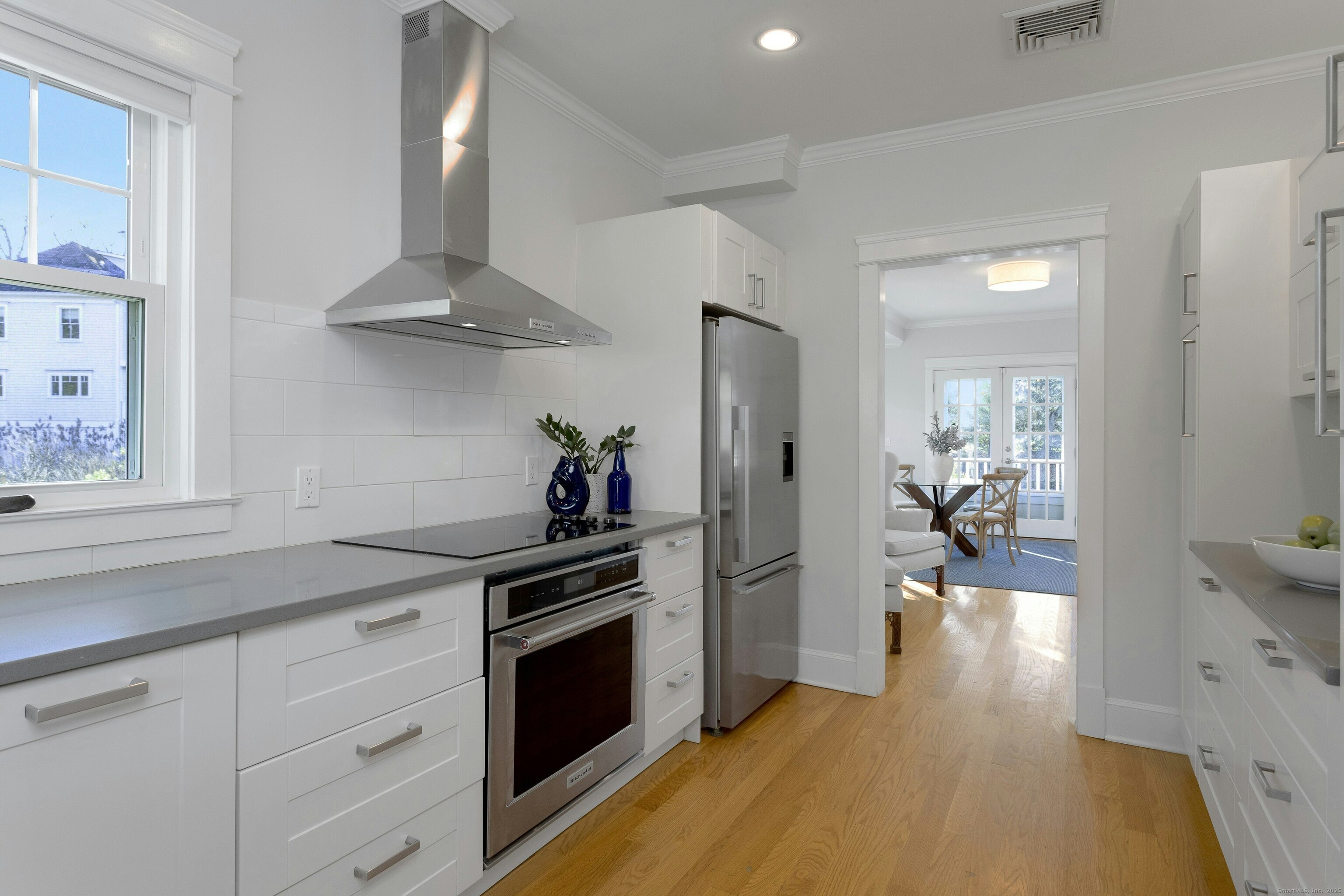 209 Rowayton Avenue Norwalk, CT 06853 - Photo 11 of 26 a kitchen with stainless steel appliances a stove a sink and a refrigerator