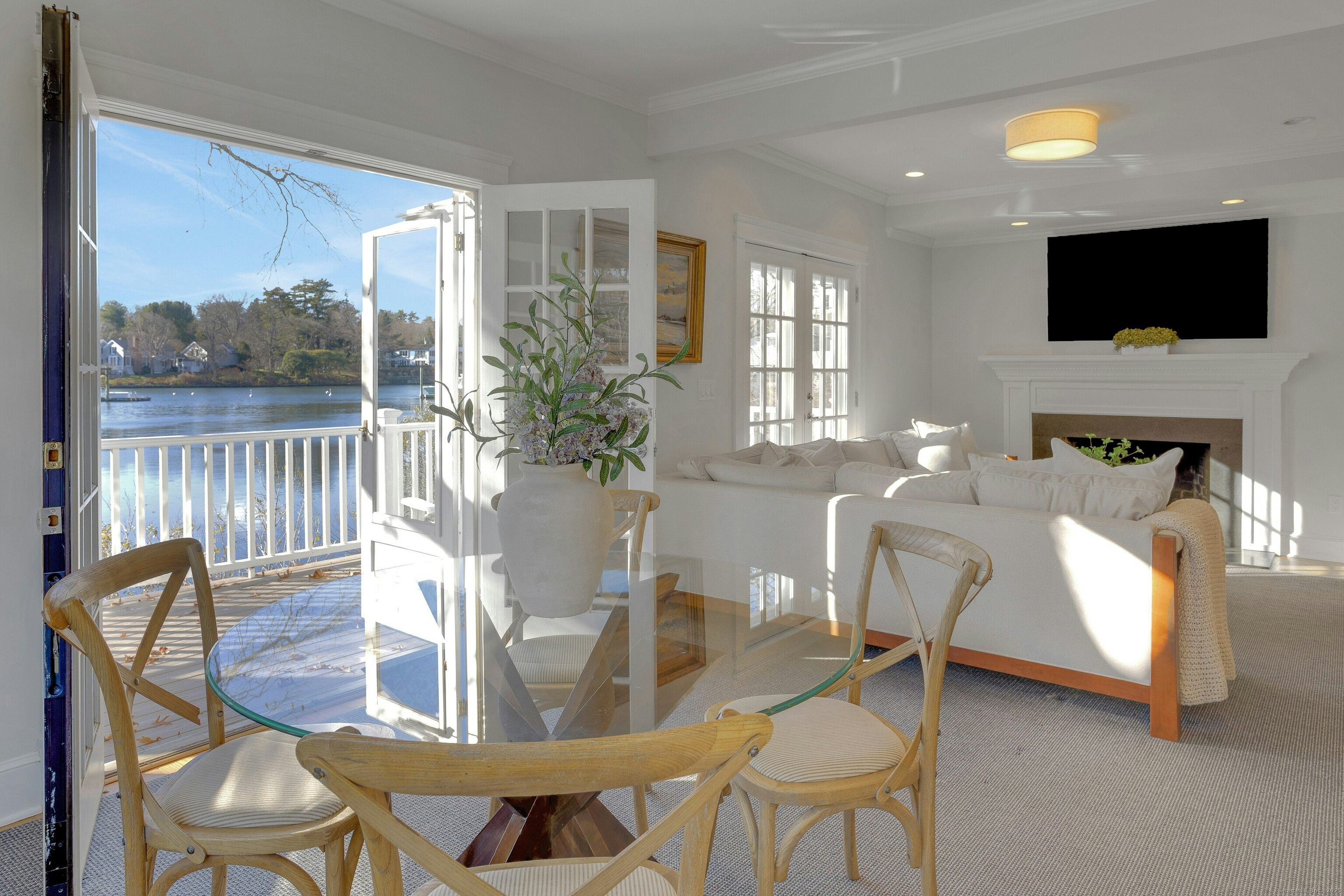 209 Rowayton Avenue Norwalk, CT 06853 - Photo 13 of 26 a living room with fireplace furniture and a flat screen tv