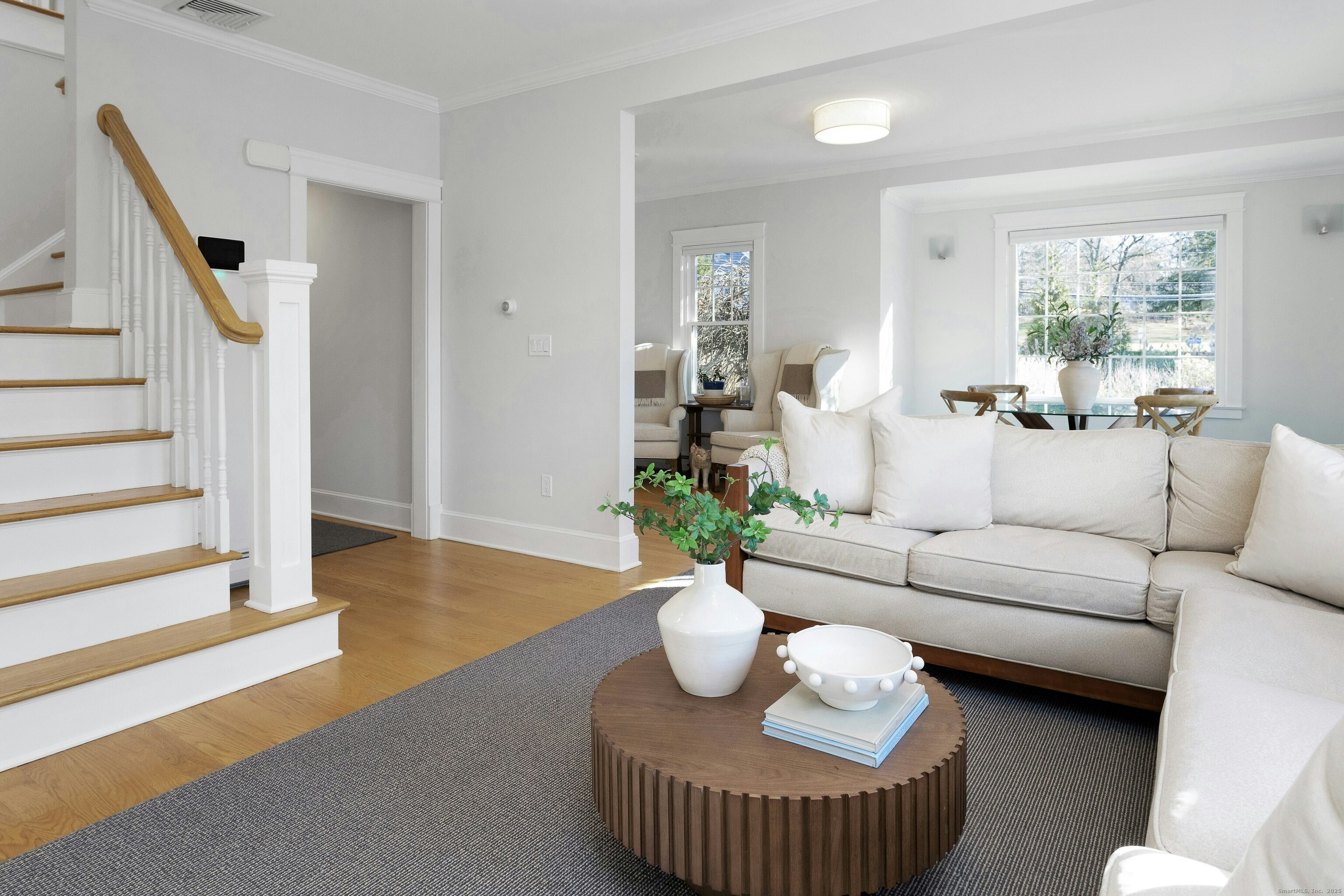 209 Rowayton Avenue Norwalk, CT 06853 - Photo 14 of 26 a living room with furniture and a potted plant