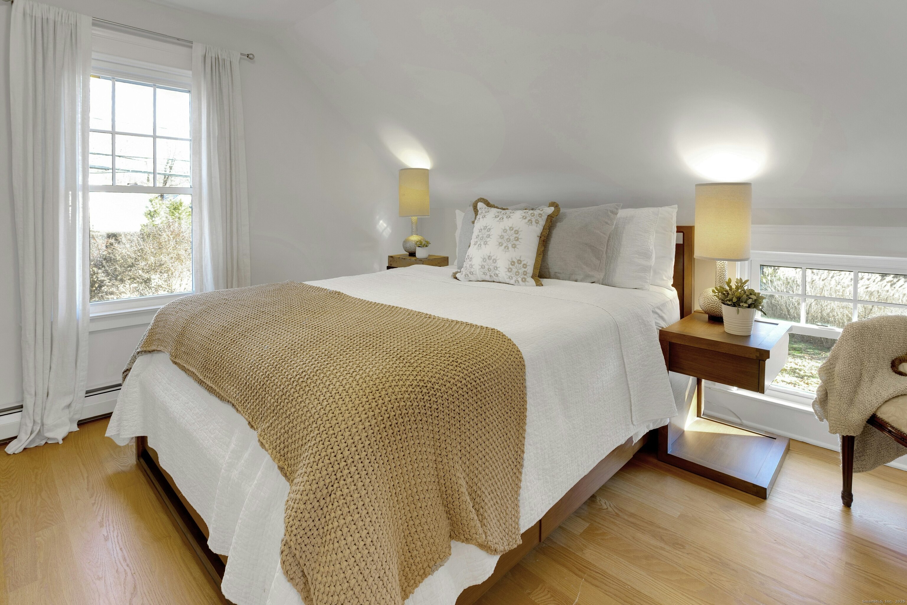 209 Rowayton Avenue Norwalk, CT 06853 - Photo 23 of 26 a bedroom with a bed and a couch