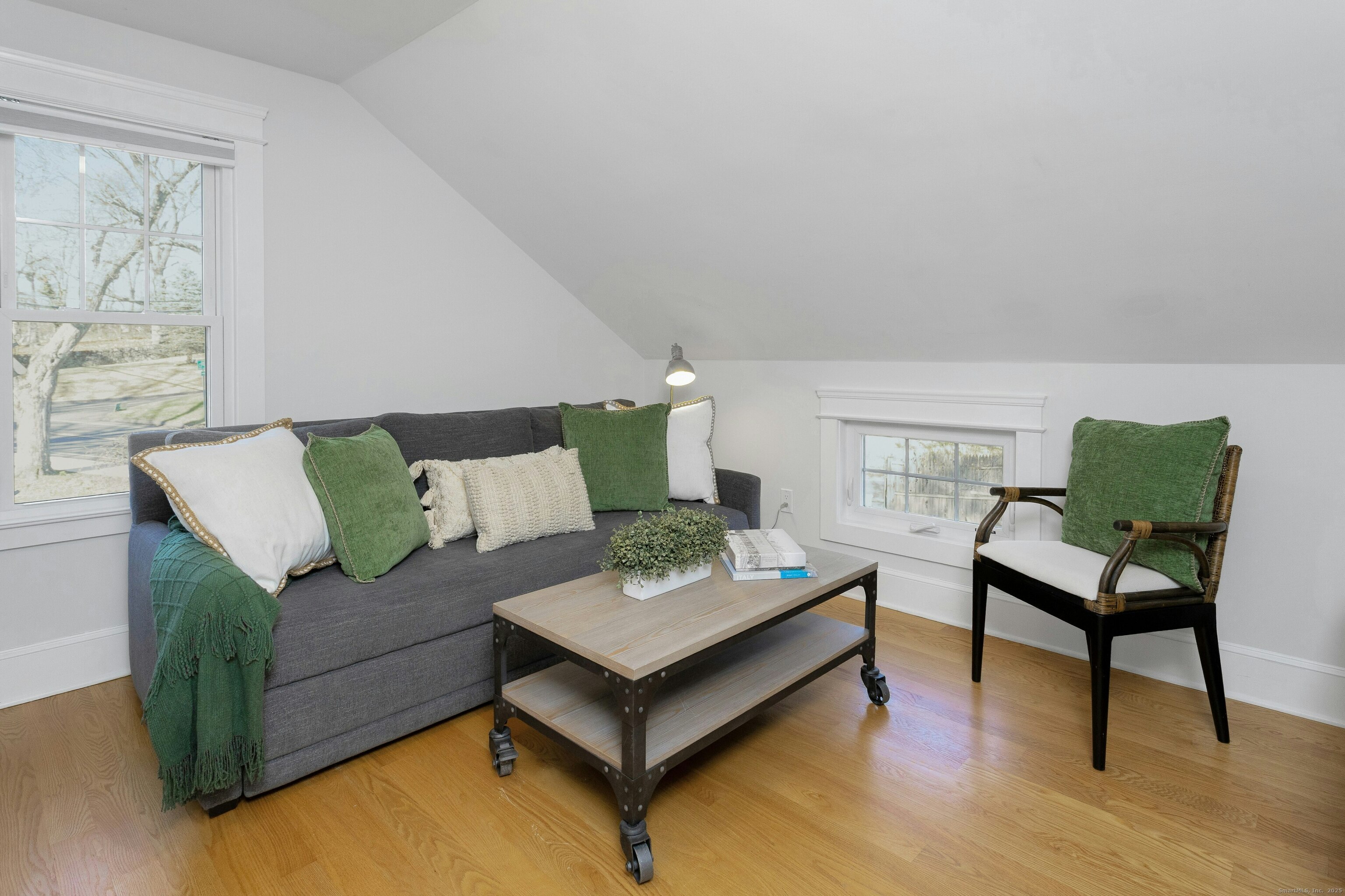 209 Rowayton Avenue Norwalk, CT 06853 - Photo 24 of 26 a living room with furniture and a wooden floor