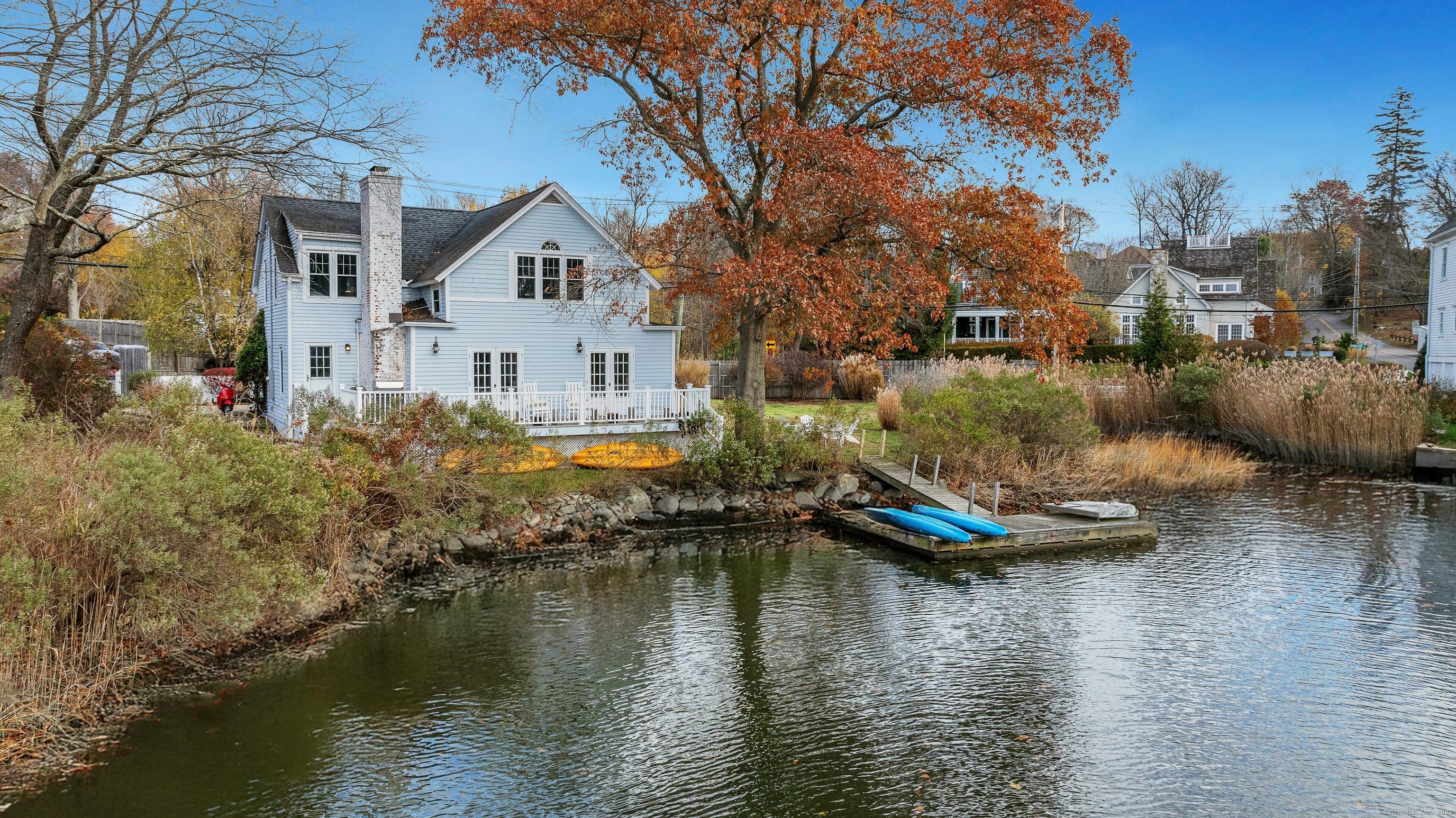209 Rowayton Avenue Norwalk, CT 06853 - Photo 26 of 26 a view of house with outdoor space and lake view