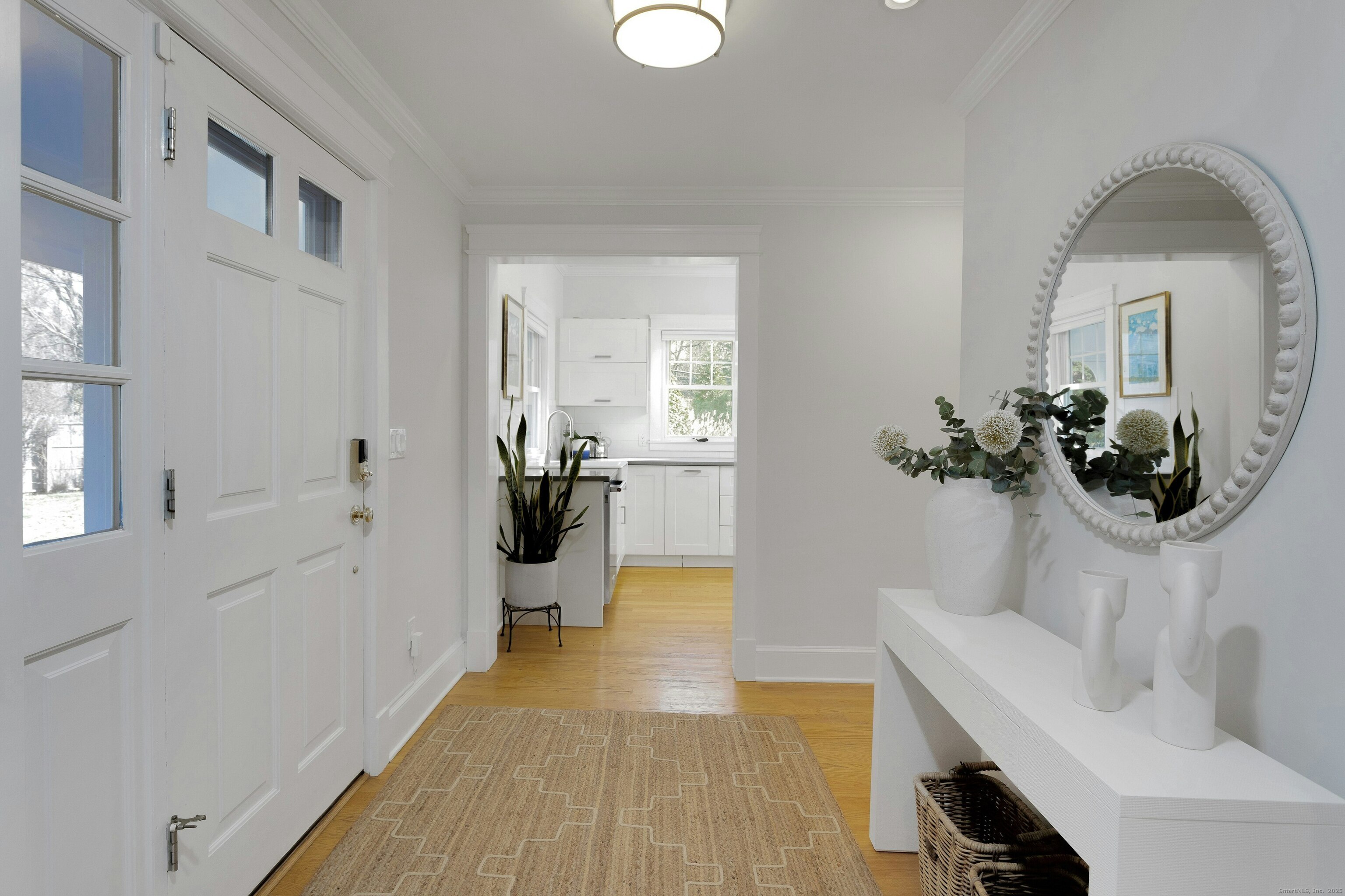209 Rowayton Avenue Norwalk, CT 06853 - Photo 9 of 26 a en suite bathroom with a sink and mirror
